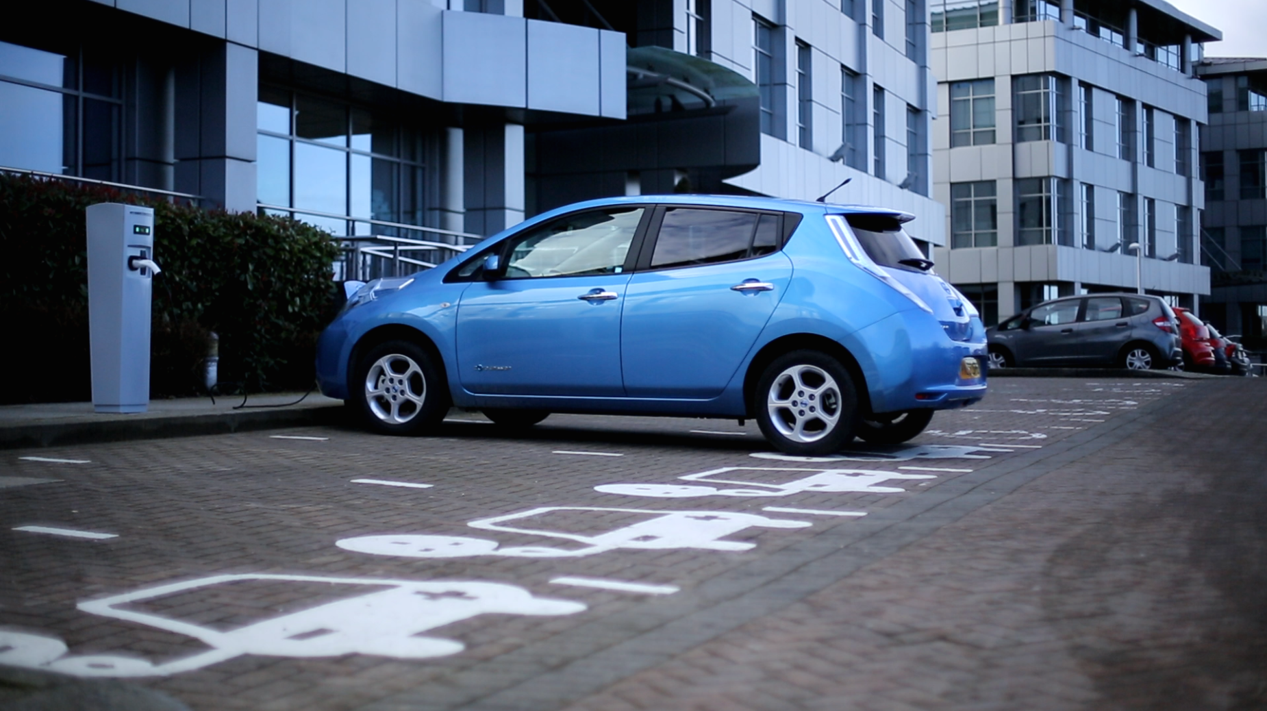 Nissan leaf car charging outside..